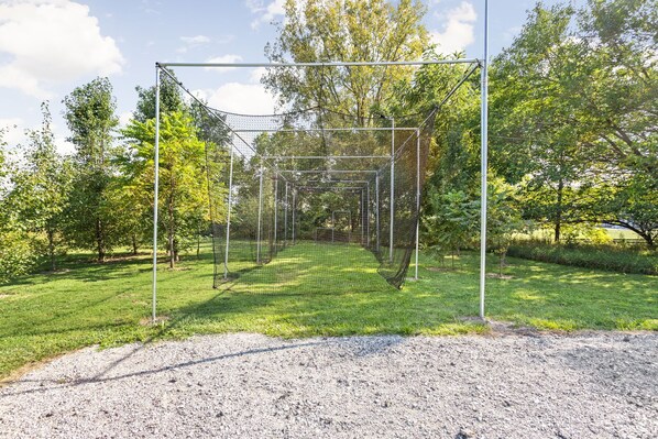 A soccer goal in a grassy area with trees in the background. - Sleeps 10/Batting Cage/Theater! (Westfield)