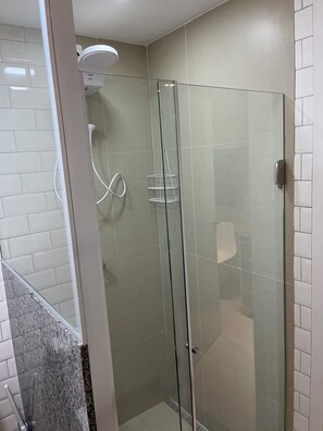 Shower, hair dryer, towels, toilet paper