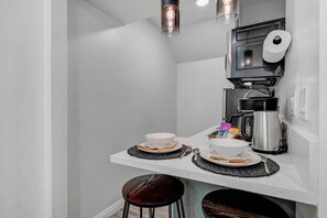 Fridge, microwave, stovetop, coffee/tea maker