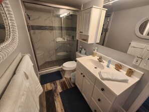Shower, hair dryer, towels, soap - Direct Beachfront Sea Oats Condo in Cocoa Beach (Cocoa Beach)