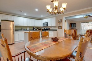Enjoy meals in the kitchen and dining area, featuring a refrigerator, microwave, and dining table.