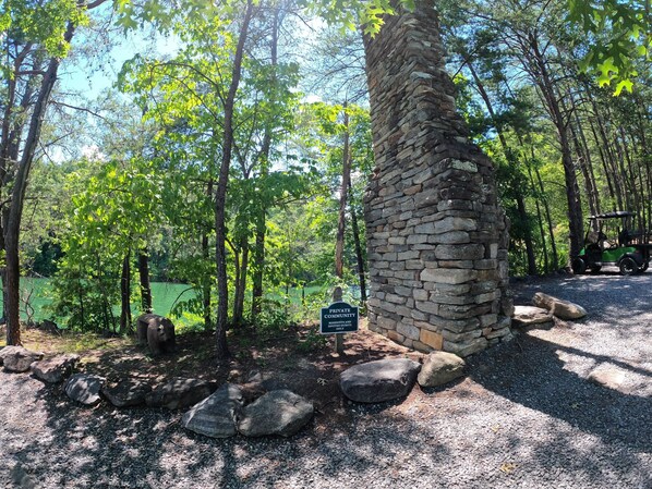 Surrounded by lush greenery and trees, this community offers a tranquil environment with a rustic charm.