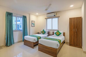 Deluxe Room | Individually furnished, desk, blackout drapes, iron/ironing board