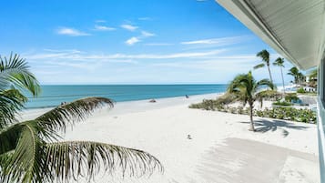 On the beach, sun-loungers, beach towels