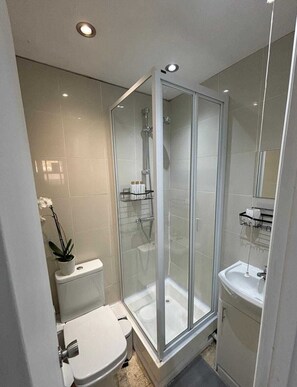 Shower, hair dryer, towels, soap