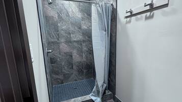 Shower, towels, soap, toilet paper