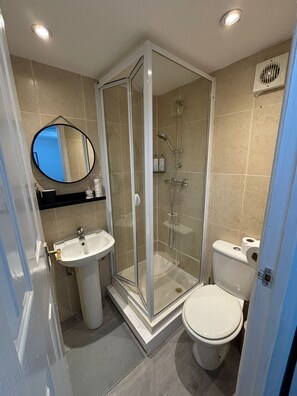 Shower, hair dryer, towels, soap