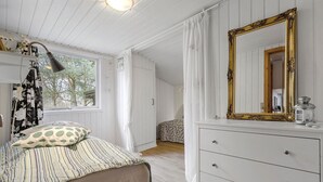 A bedroom with a bed, a dresser, a mirror, and a window. - Stunning home in Glesborg with WiFi (Glesborg)