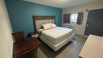 Habitación individual Deluxe | Escritorio, wifi gratis y ropa de cama