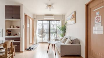 Family Apartment (with Balcony) No Cleaning Service Eco, Non Smoking | Living area | Flat-screen TV
