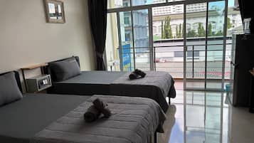 Business Condo | Premium bedding, down duvets, in-room safe, individually furnished