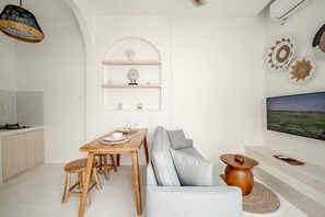 Villa, 1 Bedroom, Non Smoking, Pool View | Living room | 50-inch TV with cable channels