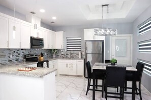 Fridge, microwave, stovetop, cookware/dishes/utensils