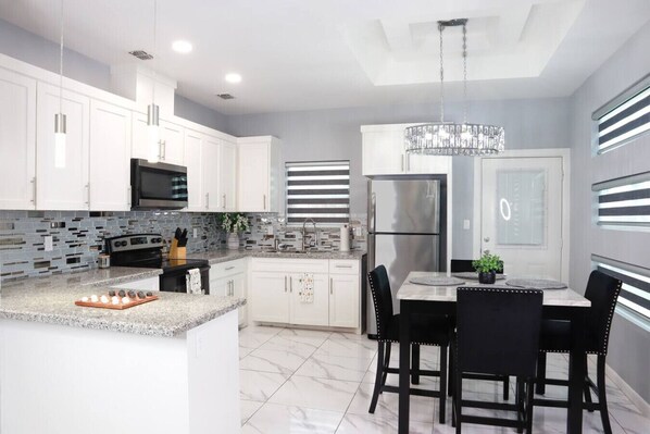 Fridge, microwave, stovetop, cookware/dishes/utensils