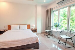 Deluxe Room | Free minibar items, desk, laptop workspace, blackout drapes