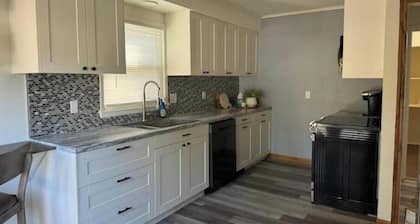 Lovely 4 bedroom Home with full kitchen, patio and on site parking