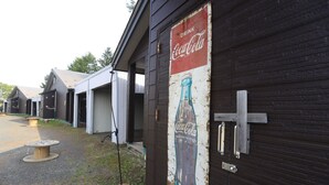 A building with a Coca-Cola sign on the side. - STARRY SKY COTTAGE 16 (Kitami)