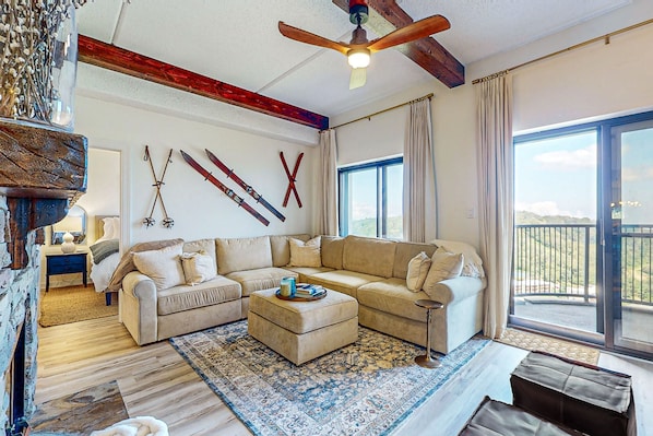Relax in this inviting living room with a comfortable sofa, coffee table, and traditional fireplace.