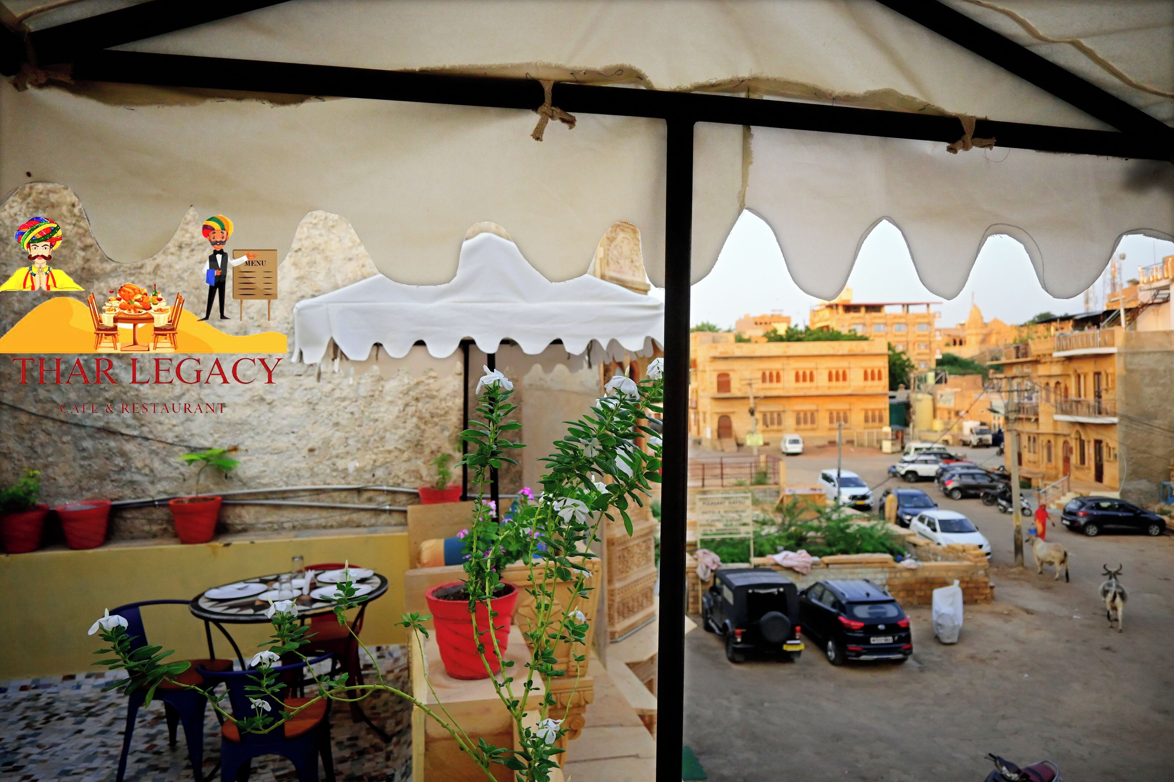 A restaurant with outdoor seating, a view of the street, and a sign reading "THAR LEGACY."