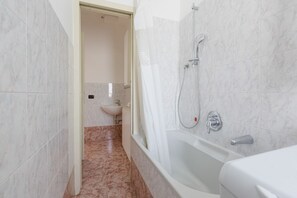 Hair dryer, bidet, towels, toilet paper
