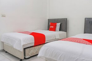Deluxe Twin Room | Premium bedding, bed sheets - Hotel O Teluk Betung Near Bank Indonesia Formerly Wisma Pmi (Bandar Lampung)