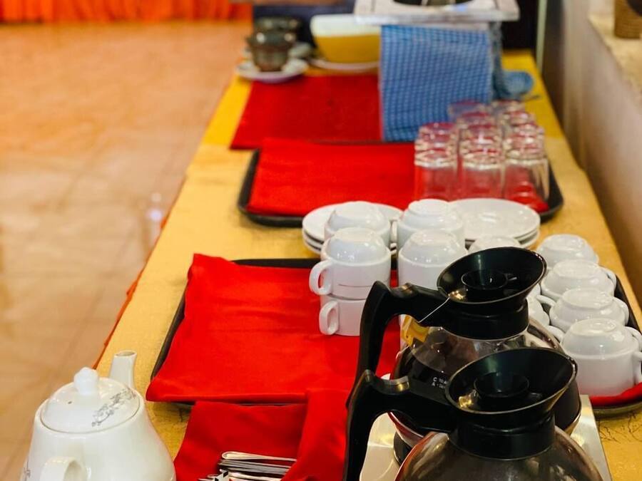 A buffet setup with various dishes and beverages.