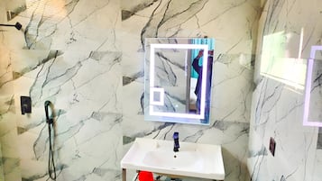 Shower, towels, soap, toilet paper