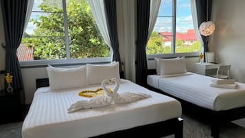 3 habitaciones, ropa de cama de alta calidad, cubrecamas y minibar