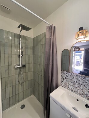 Shower, hair dryer, soap, shampoo