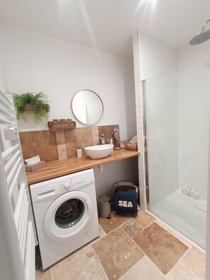 Shower, hair dryer, towels, soap