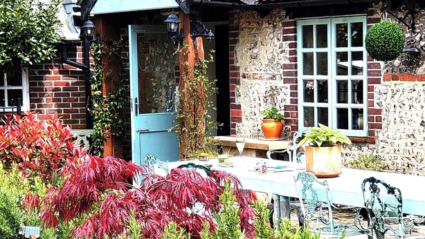A rustic house with a tiled roof, a brick exterior, and a front door. - Escape the Ordinary - Dorset Village Vacation (Dorchester)