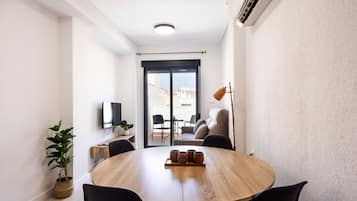 Superior Apartment | Living area | Flat-screen TV