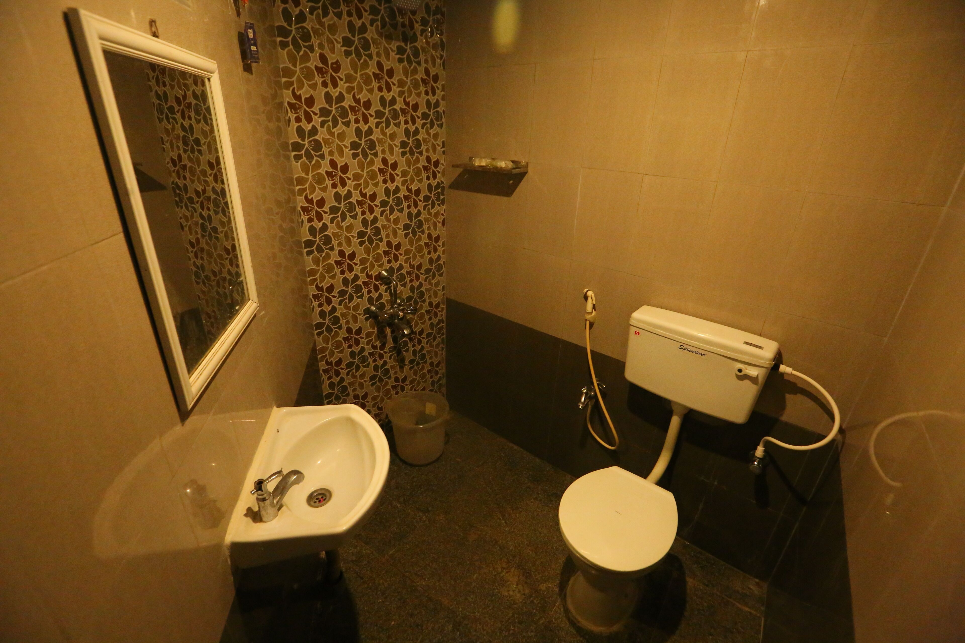 A bathroom with a sink, toilet, and shower.