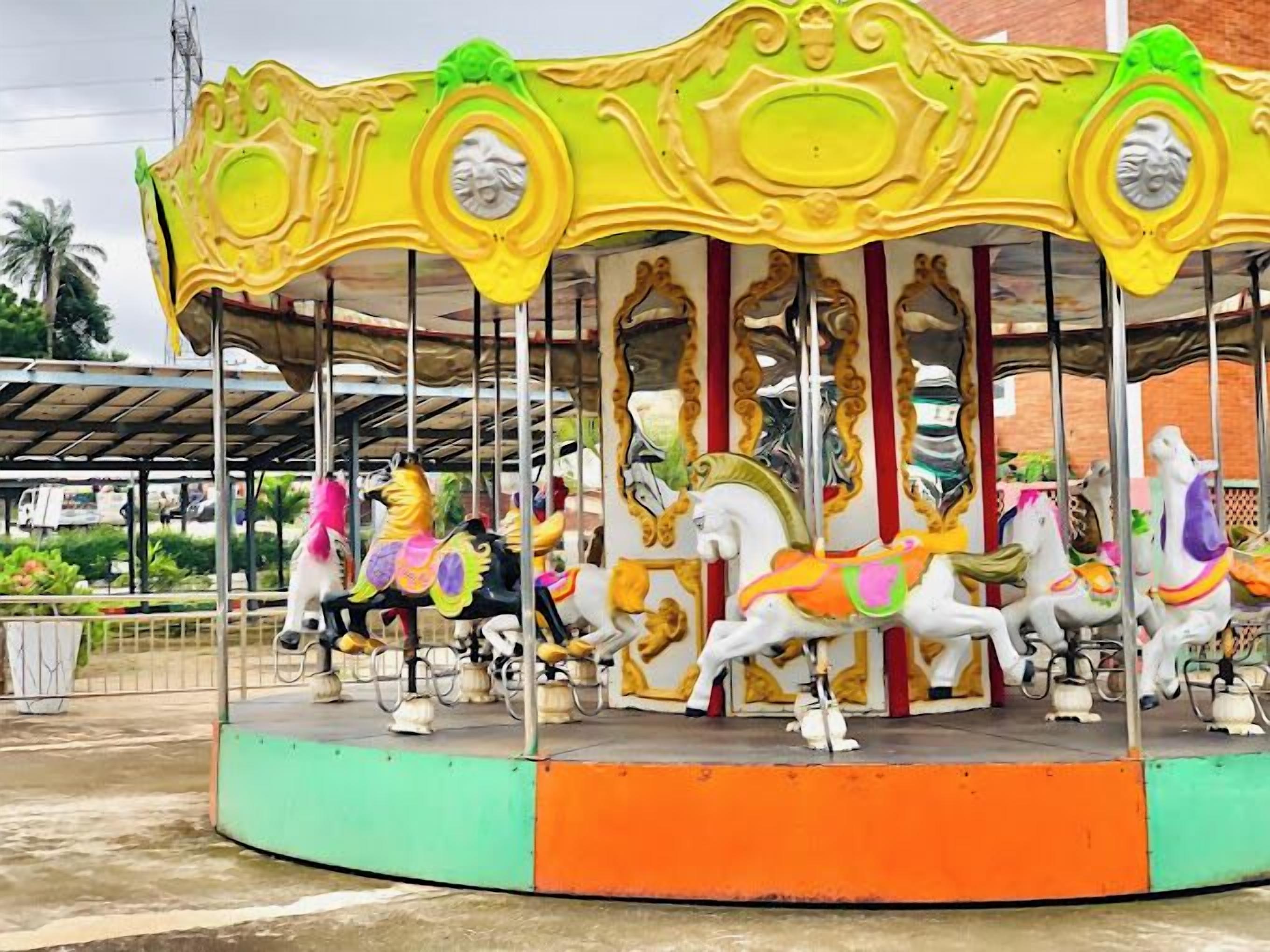 A carousel with horses and riders.