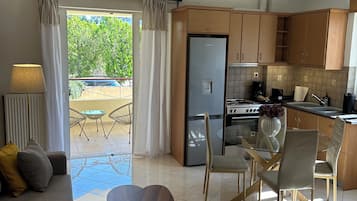Comfort Apartment, City View | Living area | 32-inch flat-screen TV with digital channels