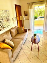 Comfort Apartment, City View | Living area | 32-inch flat-screen TV with digital channels