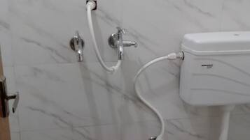 Deluxe Double Room | Bathroom | Shower, rainfall showerhead, towels, soap