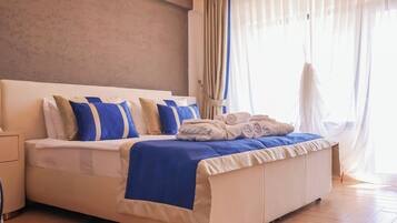 Deluxe Suite, Balcony, Sea View | In-room safe, soundproofing, iron/ironing board