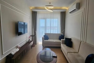 Deluxe Suite, Balcony, Sea View | Living area