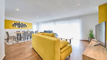 Classic Apartment, 2 Bedrooms, Ground Floor | Living area | 50-inch flat-screen TV with cable channels, heated floors