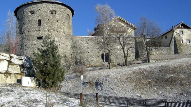 A historic stone building with a round tower, a large central building, and a smaller structure to the right. - Chalet in Radstadt Near Ski Slopes & Spa (Radstadt)