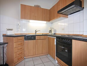 Appartement | Cuisine privée | Chaise haute