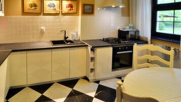 Villa | Private kitchen | Electric kettle, toaster, high chair