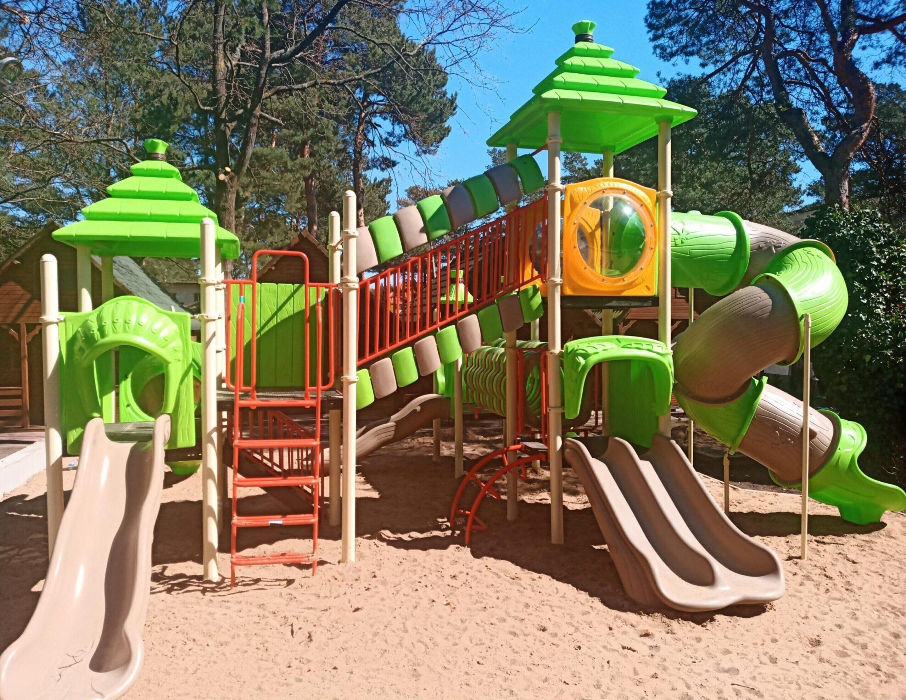A playground with slides and climbing structures.