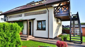 A modern two-story building with a sign reading "AMELIA APARTMENTY". - Comfortable Holiday Apartment, air Conditioning (Ustronie Morskie)