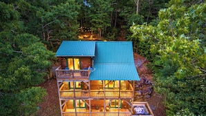 A multi-level log cabin with a green roof, multiple decks, and a hot tub. - Cabin On 8-Private Acres, Hot Tub, Game Room, Views (Bryson City)