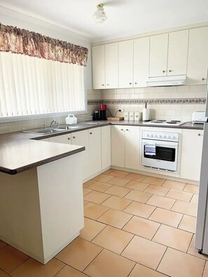 Fridge, microwave, oven, stovetop - Welcome to Suburban Bliss: Elegant Villa 2! (Wagga Wagga)