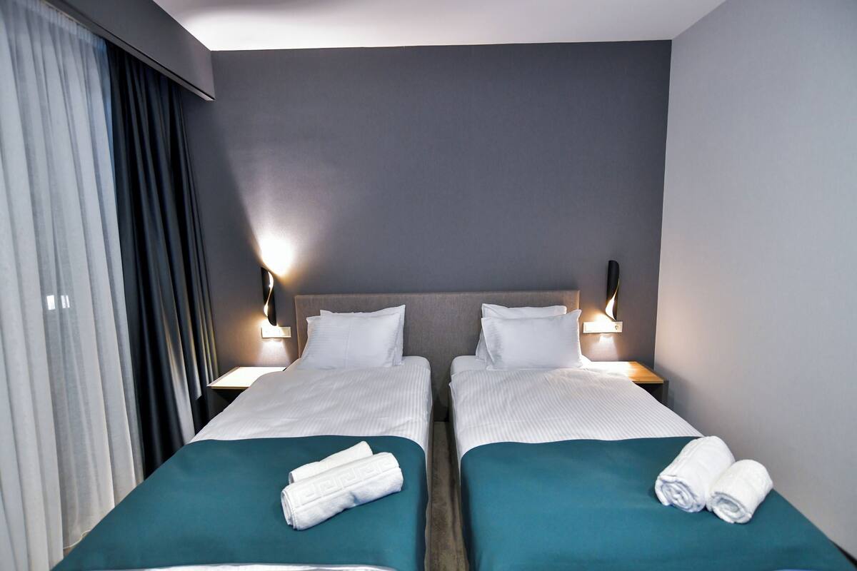 Standard Double or Twin Room, Balcony | Bathroom | Shower, hair dryer, slippers, towels