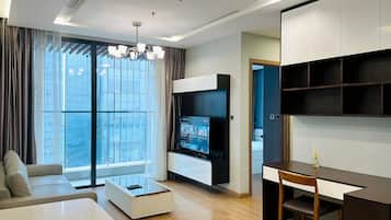 Deluxe Apartment, 1 Bedroom, City View | Living room | 60-inch flat-screen TV with cable channels