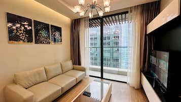 Deluxe Apartment, 1 Bedroom, City View | Living room | 60-inch flat-screen TV with cable channels